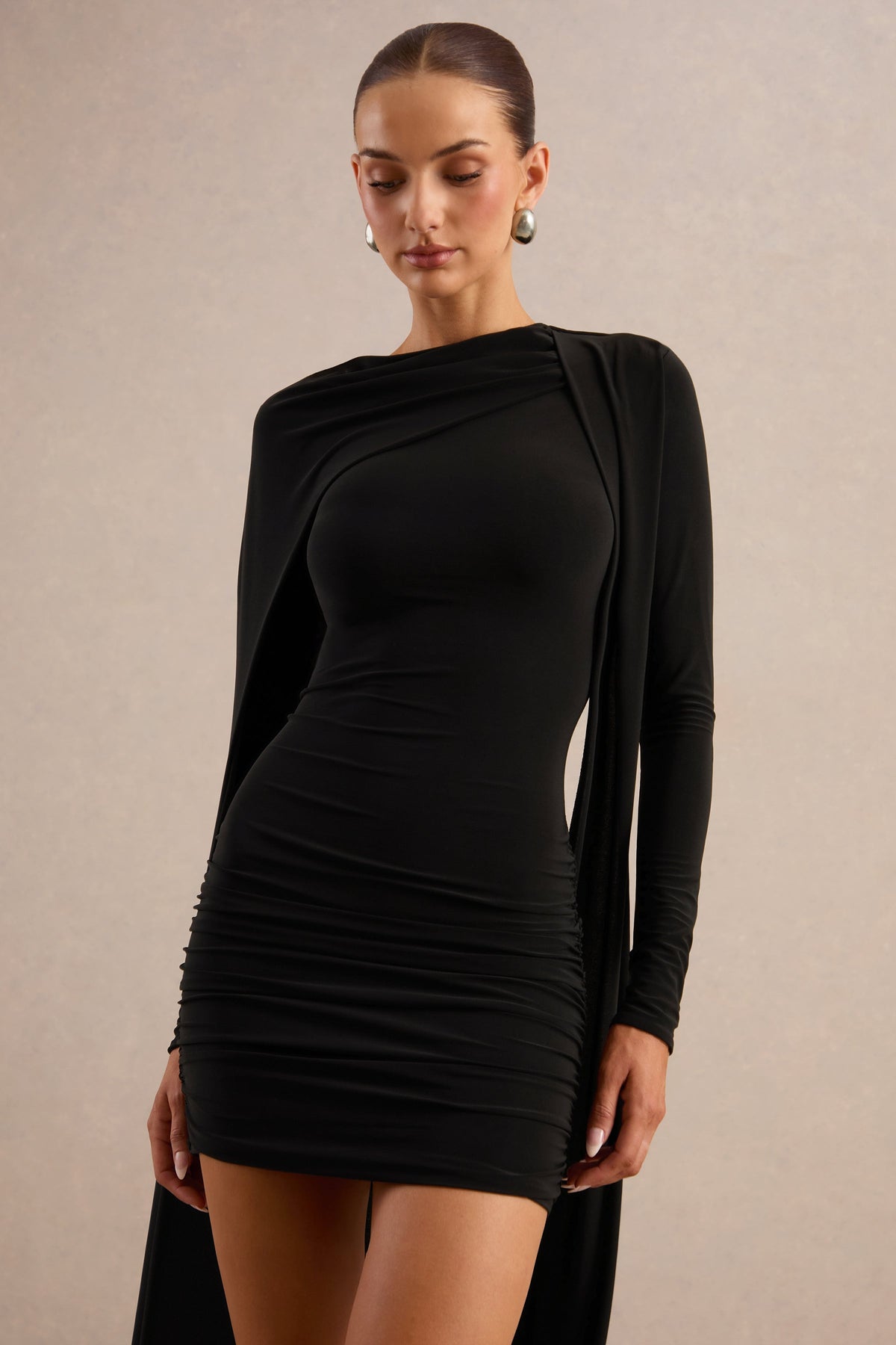 Ilse | Black Jersey Round Neck Long Sleeve Mini Dress With Gathered Detailing And Cape